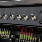 Toggle Switch DPDT Momentary Sealed TB302E installed and in use on dashboard switch panel