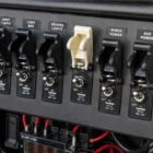 Toggle Switch Missile Cover White installed and in use on dashboard switch panel