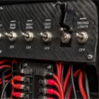 Toggle Switch Narva SPST 20A With Black Missile Switch Cover installed on dashboard panel
