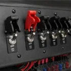 Red missile switch cover installed on toggle switch dashboard panel