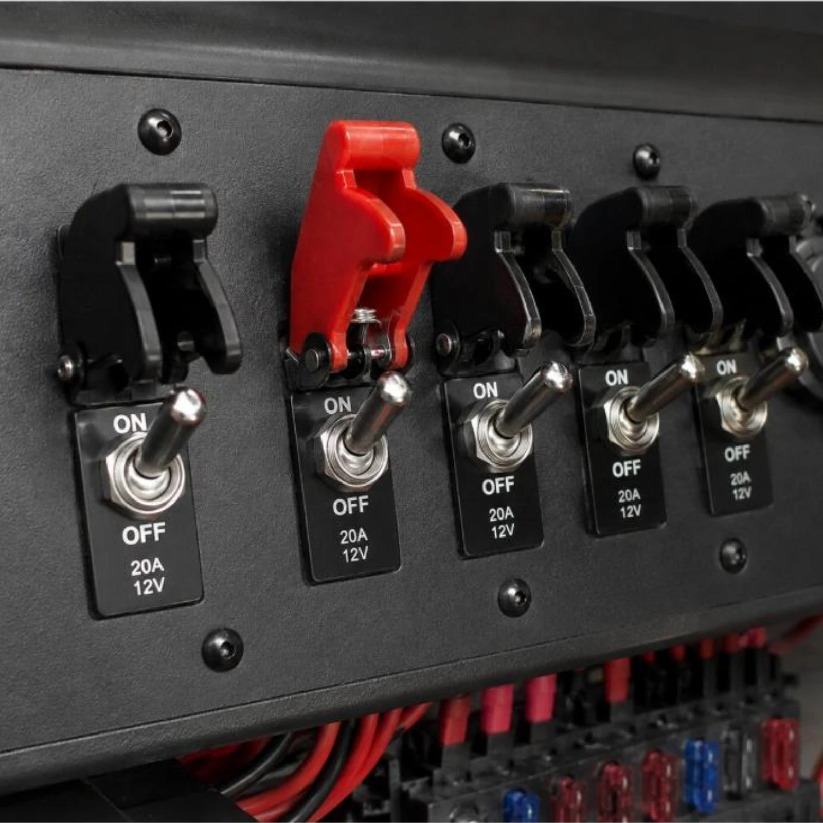 Red missile switch cover installed on toggle switch dashboard panel