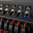 Toggle Switch TS-011B (Blue LED) installed flush in boat dashboard panel wired to fuse holder