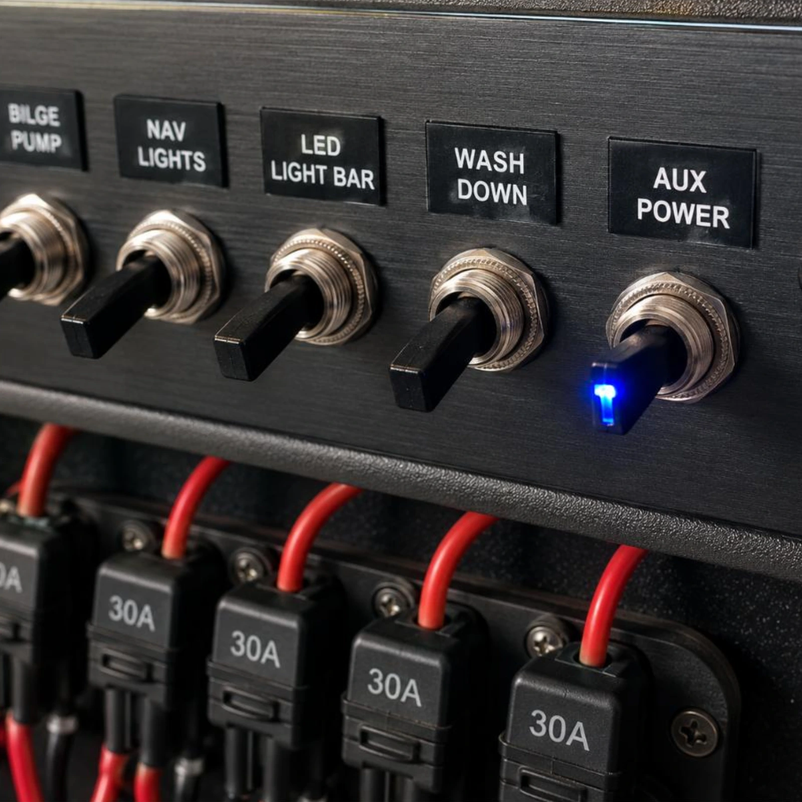 Toggle Switch TS-011B (Blue LED) installed flush in boat dashboard panel wired to fuse holder