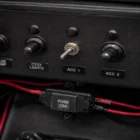 Toggle Switch TS-041 installed flush in boat dashboard panel wired to fuse holder