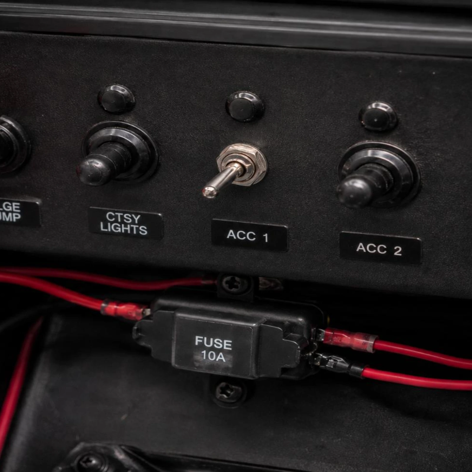 Toggle Switch TS-041 installed flush in boat dashboard panel wired to fuse holder