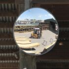 Heavy duty convex safety mirror in a timber yard