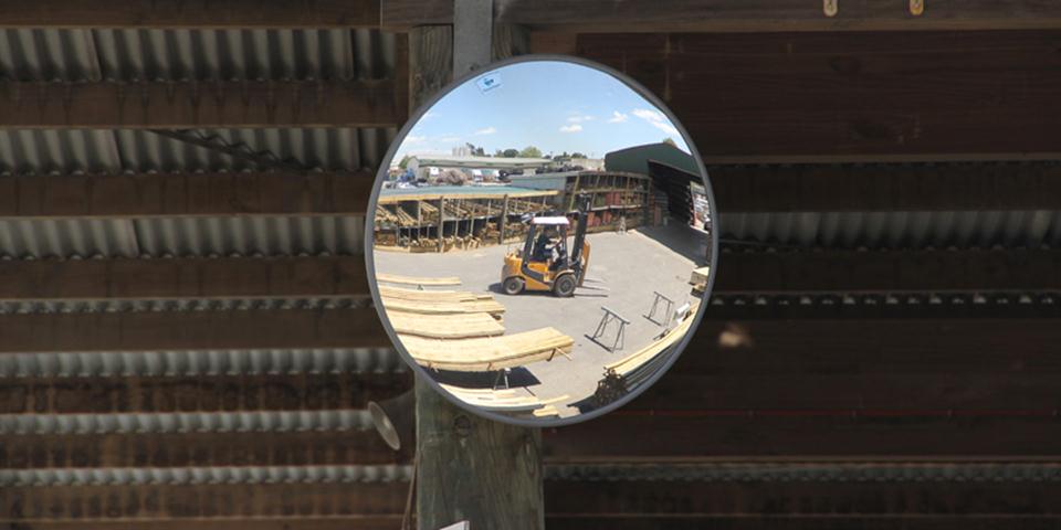 Heavy duty convex safety mirror in a timber yard