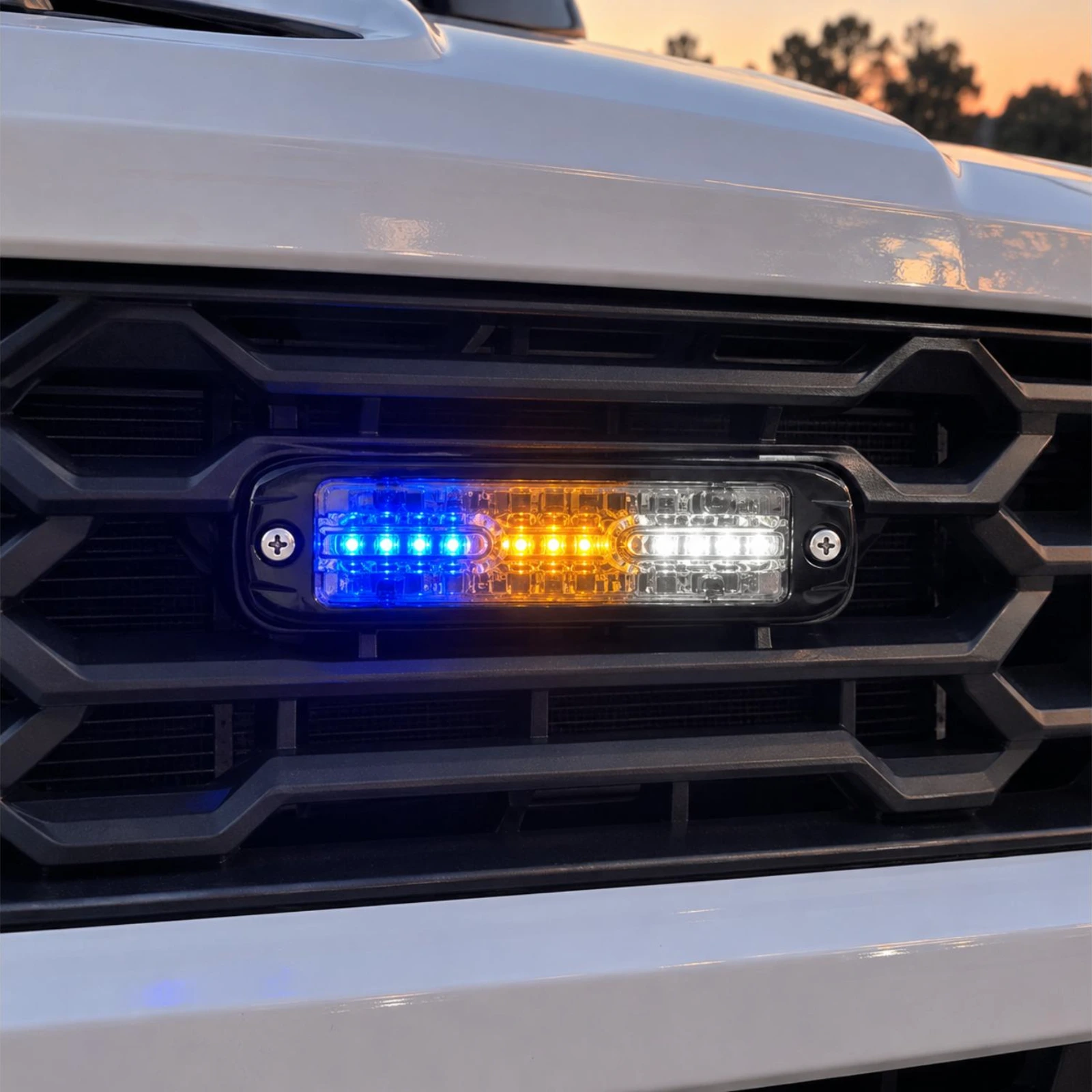 ECCO ED3802BAW blue/amber/white ultra thin LED directional light in use on a emergency services vehicle grille