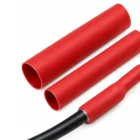 Red adhesive-lined dual wall heat shrink tubing, unshrunk and shrunk onto a cable